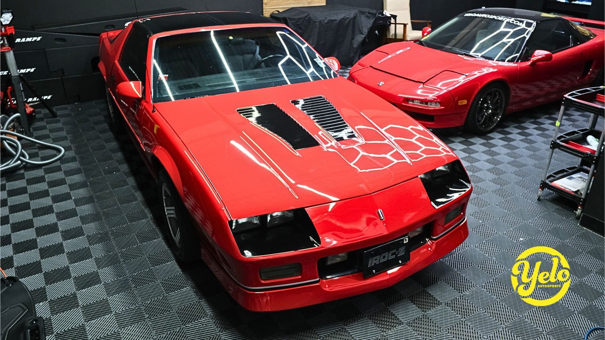 Detailed Chevrolet Camaro IROC-Z and Acura NSX in the Yelo Autosports shop — Minneapolis MN